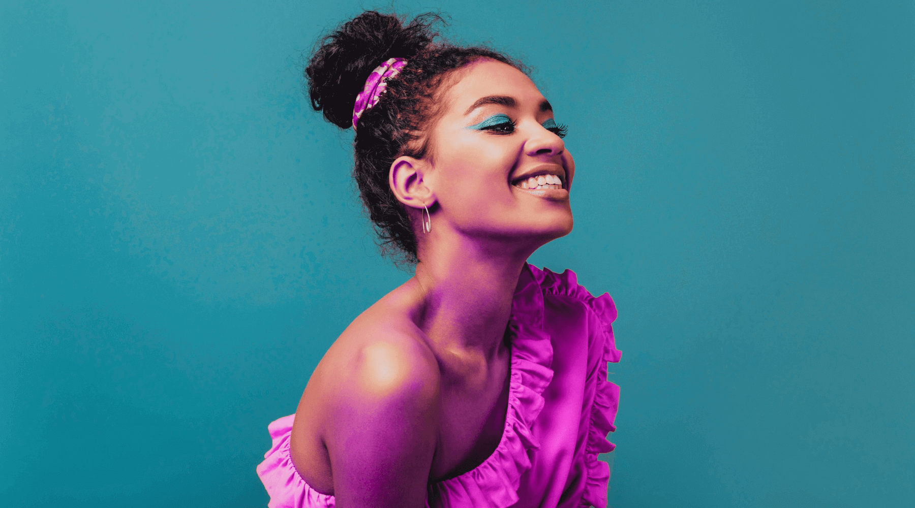 A happy woman with a high bun