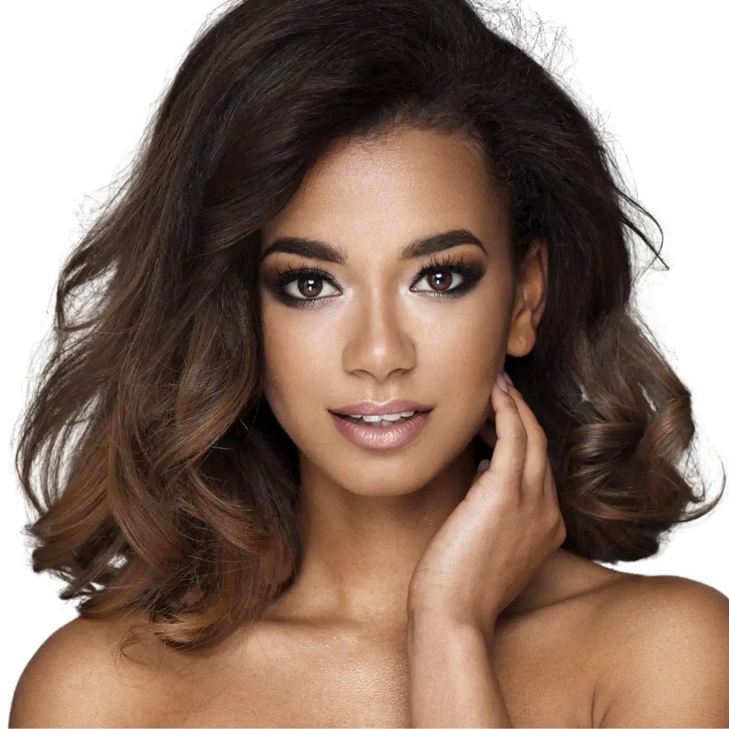 A gorgeous Black model with a shoulder length wavy hairstyle with light brown highlights