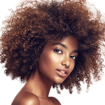 A Black model with voluminous auburn-burgundy hair