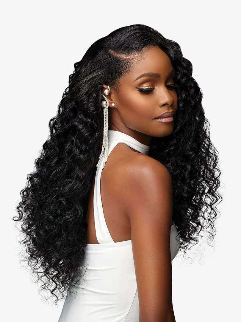 Partial back profile of a model with Sensationnel® Pearlish™ Euro Deep Wave hair extensions